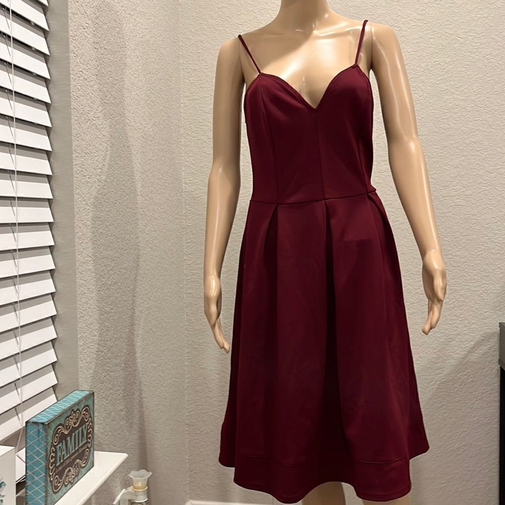 Nwt ModCloth dress with adjustable straps in a rich burgundy color